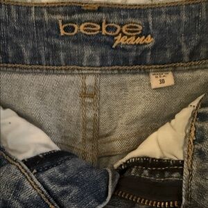 bebe cutoff shorts with holes and distressed.